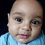 Angel is registered to the contest to win money with this photo: baby, infant, face, eyes, blue_clothing, portrait, closeup, child, cute, skin, head, expression, young, adorable, person, newborn, apparel, looking, studio, soft_light