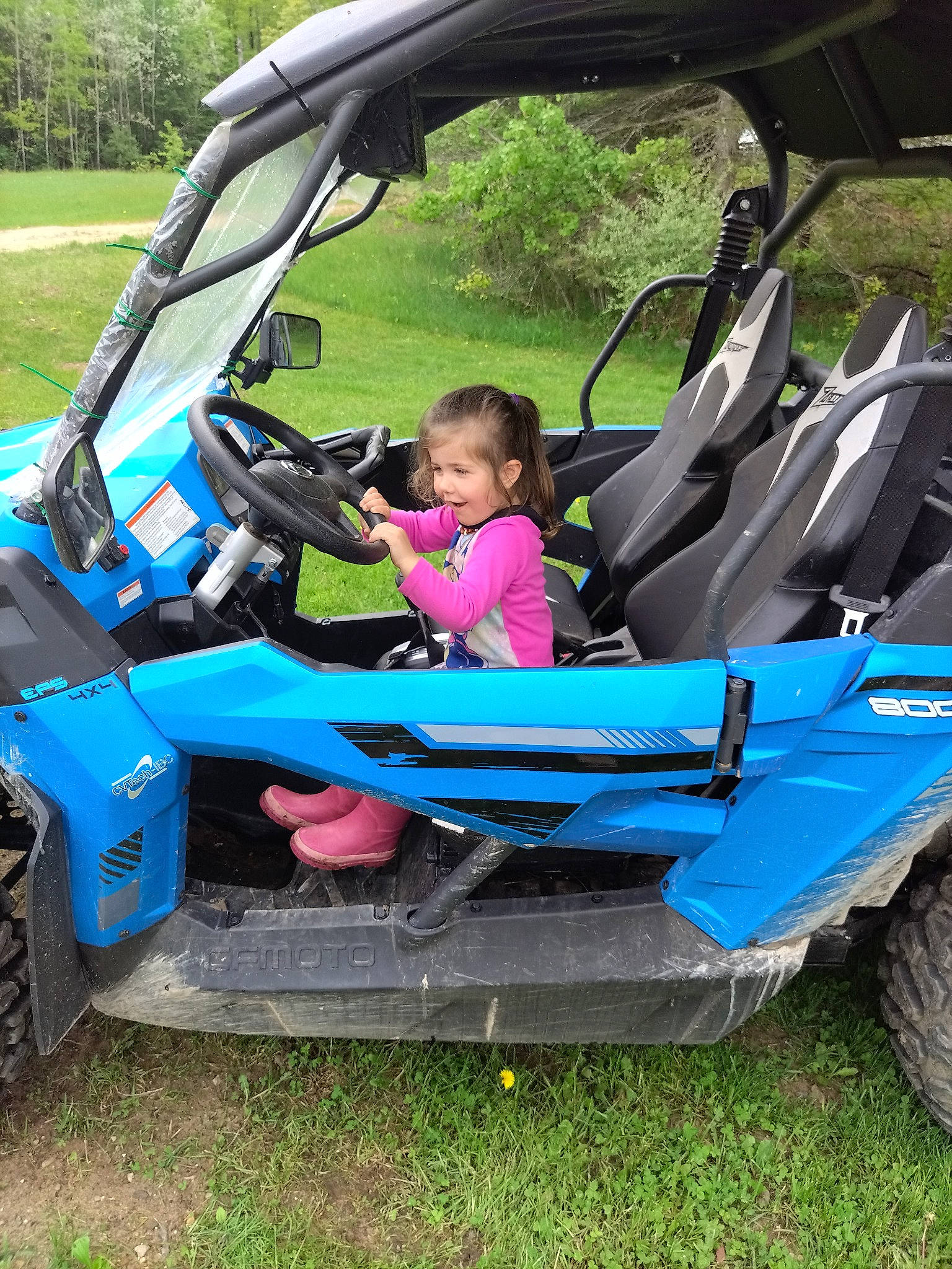 Shylo is registered to the contest to win money with this photo: auto_part, automotive_design, automotive_exterior, automotive_tire, automotive_wheel_system, bumper, electric_blue, fender, fun, grass, hood, leisure, motor_vehicle, person, plant, recreation, tire, tree, vehicle, vehicle_door