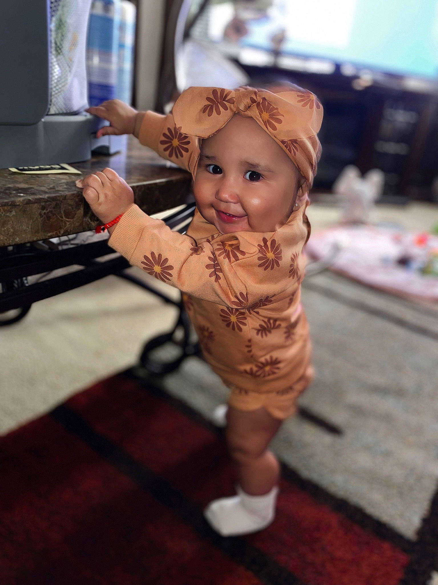 Analia is registered to the contest to win money with this photo: baby, cap, child, fashion_accessory, fashion_design, flooring, fun, happy, hat, headgear, headwear, human_leg, joy, leisure, person, road, sandal, sitting, street, sun_hat