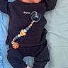 Joseph participe au concours pour gagner de l'argent avec cette photo : baby, newborn, sleeping, pacifier, clothing, shoes, blanket, blue, cute, infant, child, person, sleep, cozy, cute_outfit, accessory, lying_down, peaceful, indoors, portrait