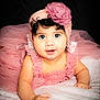 baby, infant, tutu, headband, flower, pink, dress, curly_hair, blue_eyes, soft_blanket, portrait, cute, child, smiling, indoor, studio_lighting, close_up, crawling, happy, person