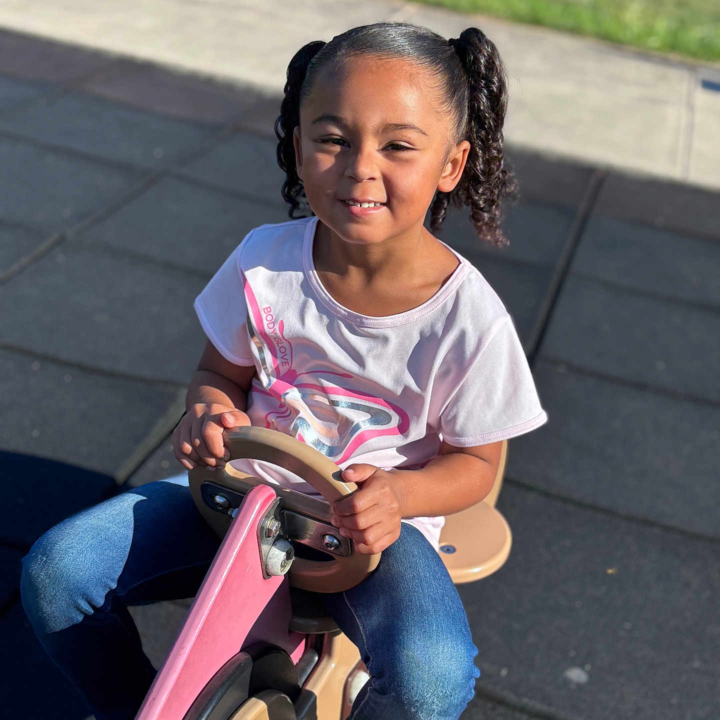 Adelaide joined the competition — help win amazing prizes! bodypart, child, clothing, face, female, finger, footwear, girl, hand, happy, head, pants, person, photography, portrait, shoe, sitting, smile, transportation, vehicle