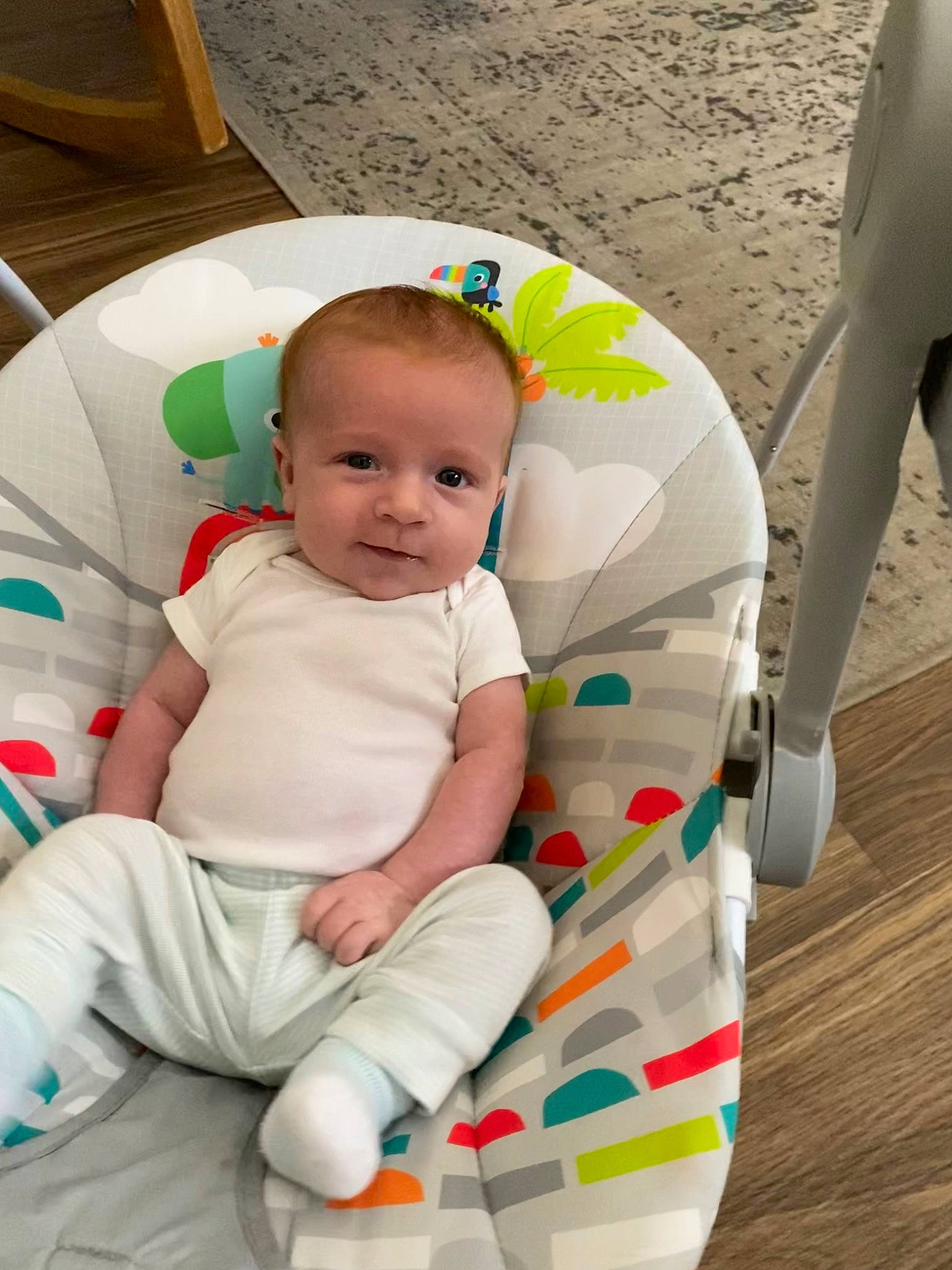 Connor is registered to the contest to win money with this photo: baby, baby_products, baby_toddler_clothing, child, comfort, flooring, foot, fun, happy, human, human_leg, knee, lap, leisure, person, play, sitting, sock, thigh, toddler