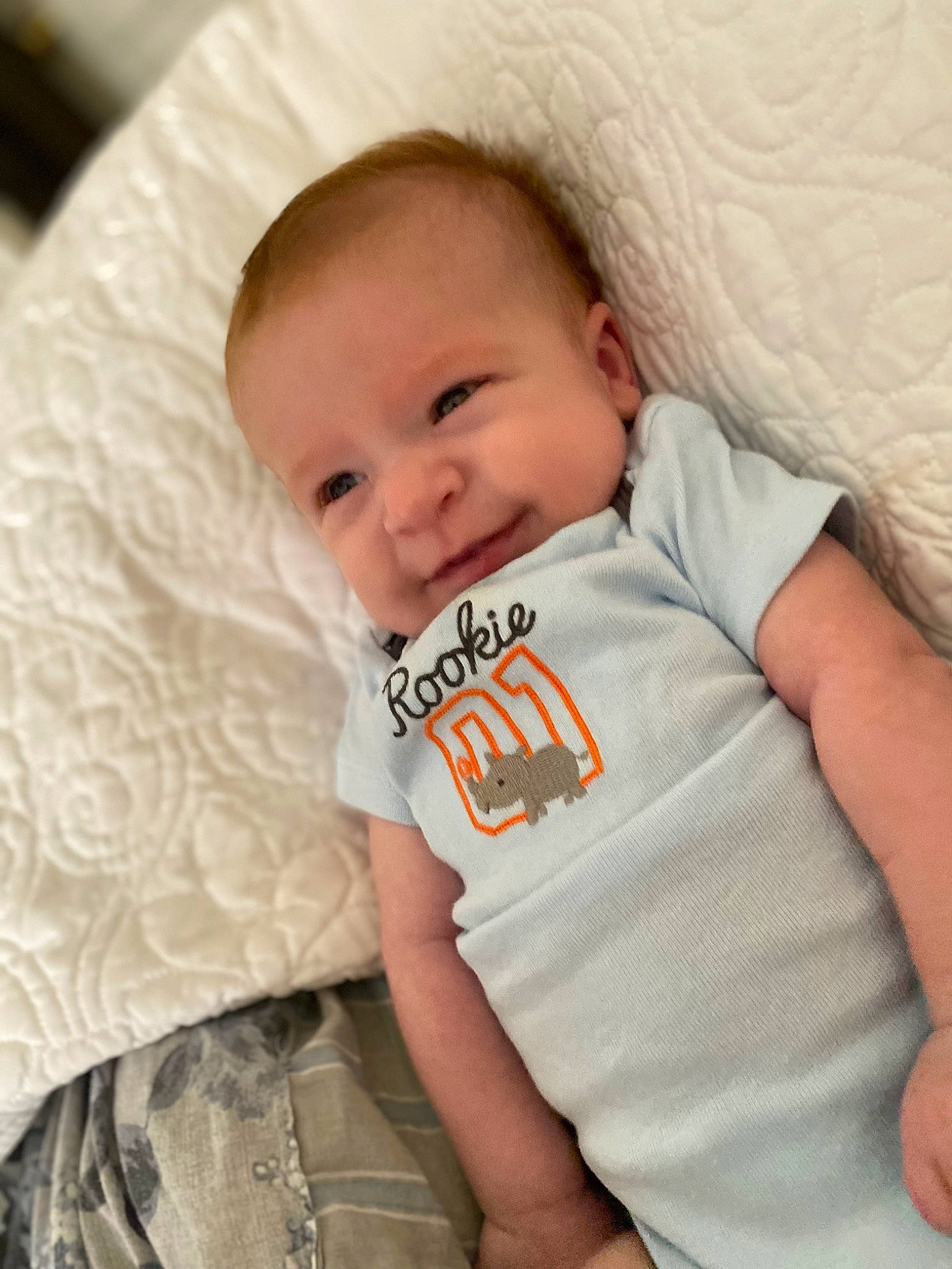 Connor is registered to the contest to win money with this photo: baby, baby_toddler_clothing, cheek, child, comfort, eyebrow, happy, iris, linens, lip, mammal, neck, nose, person, sitting, skin, sleeve, smile, t_shirt, textile