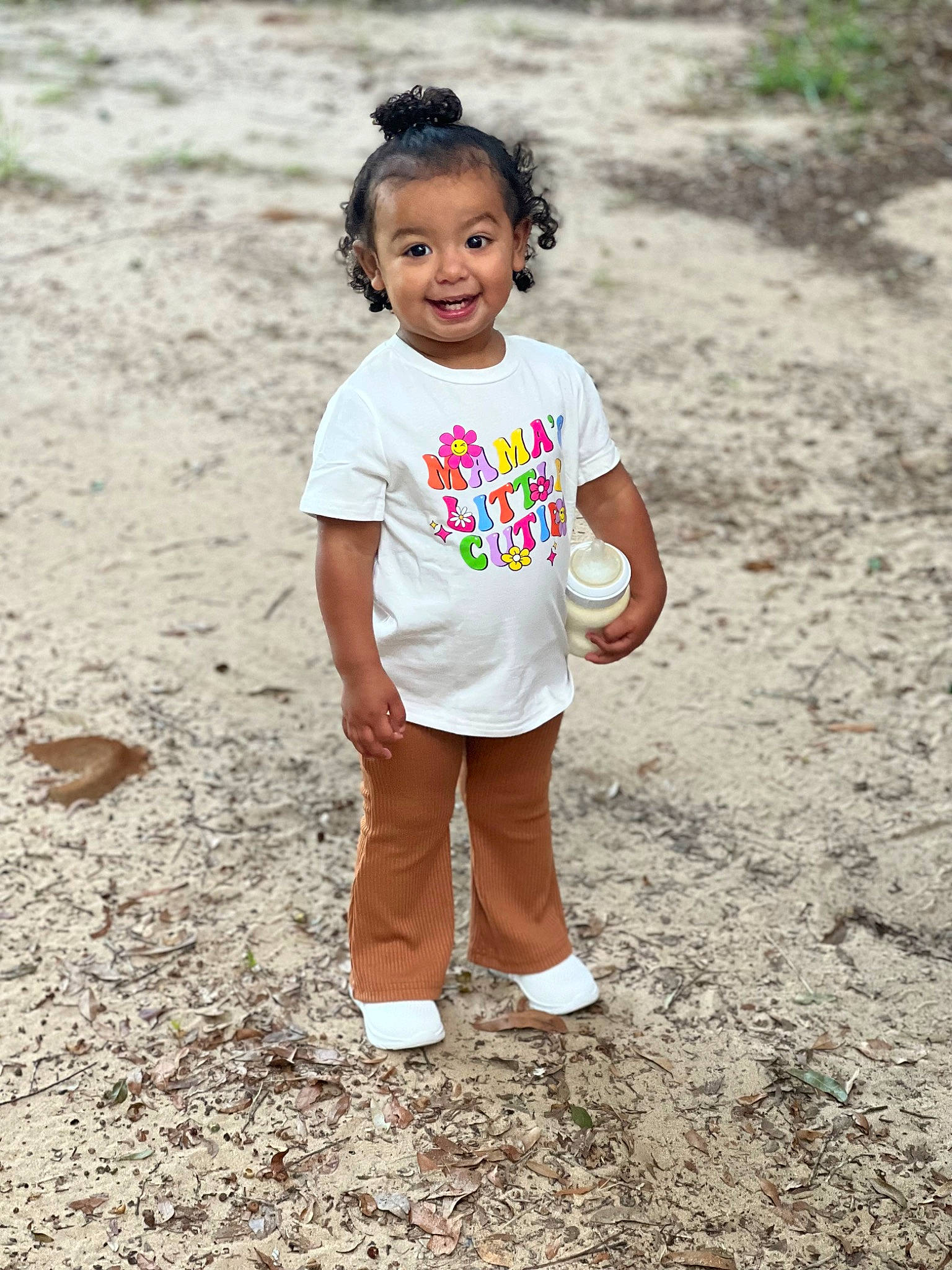 Callie joined the competition — help win amazing prizes! child, face, fun, grass, happy, head, human_leg, joy, landscape, leisure, people_in_nature, person, plant, play, recreation, sleeve, smile, soil, t_shirt, toddler
