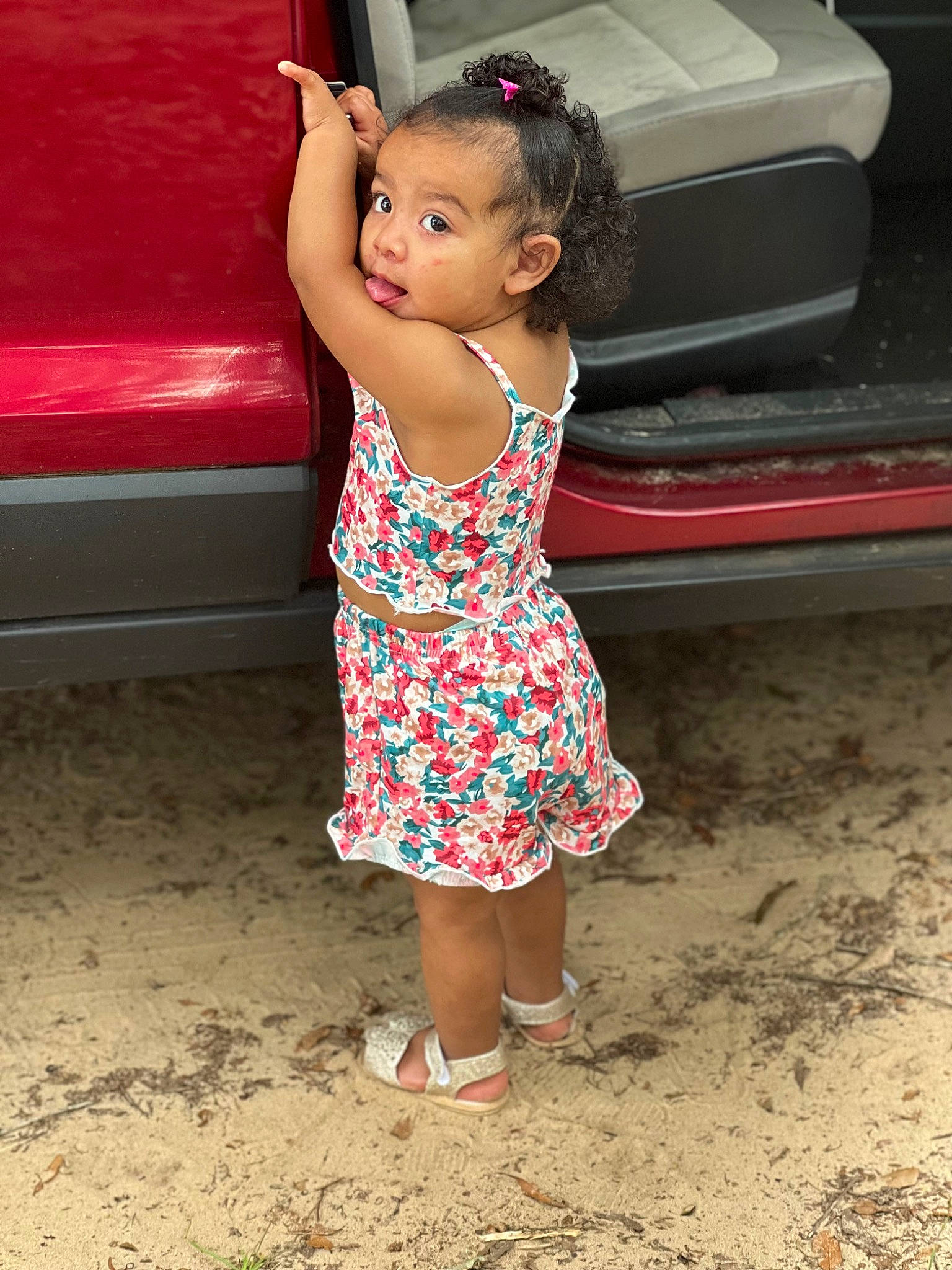 Callie is registered to the contest to win money with this photo: baby_toddler_clothing, bumper, dress, eye, face, flash_photography, hand, happy, head, human_leg, leg, leisure, magenta, person, pink, sandal, shoulder, skin, surprise, thigh