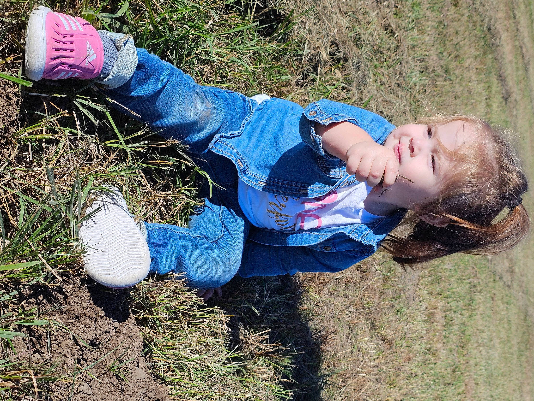 Malani joined the competition — help win amazing prizes! child, denim, electric_blue, foot, fun, glove, grass, grassland, happy, human_leg, landscape, leisure, people_in_nature, person, plant, portrait_photography, sitting, soil, toddler, winter
