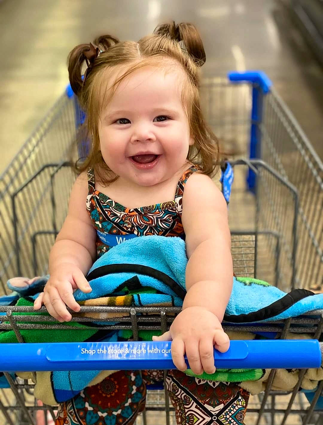 Malani is registered to the contest to win money with this photo: beauty, bicycle_tire, blond, child, electric_blue, eye, fun, grass, hair, happy, head, human_body, iris, joy, leisure, person, sitting, skin, smile, tire