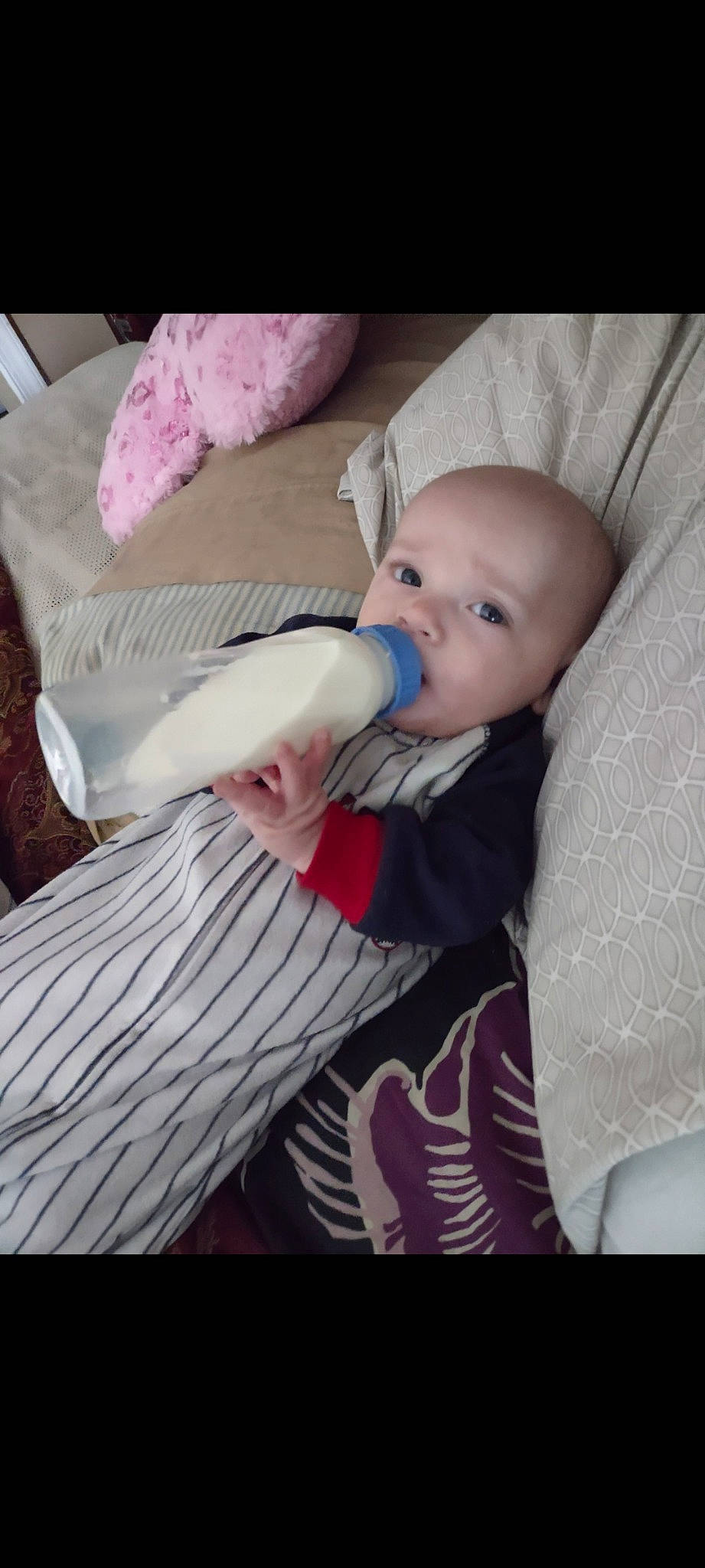 Robbie joined the competition — help win amazing prizes! baby, baby_carriage, baby_products, baby_safety, baby_toddler_clothing, cheek, child, comfort, iris, linens, magenta, nail, person, pink, purple, room, sitting, skin, textile, toddler