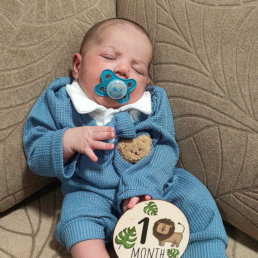 Muhammad Ali joined the competition — help win amazing prizes! architecture, baby, bodypart, building, clothing, couch, cushion, face, finger, furniture, hand, head, homedecor, indoors, newborn, pants, person, photography, portrait, sitting