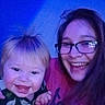 William is registered to the contest to win money with this photo: baby, child, woman, glasses, smile, happy, indoor, portrait, face, people, joy, friendship, closeup, casual, holding, clothing, hair, young, fun, together