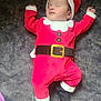 baby, infant, sleeping, christmas_costume, santa_hat, red_clothing, black_booties, face, closed_eyes, child, holiday_theme, cute, cozy, blanket, soft, lying_down, adorable, festive, one_person, indoors