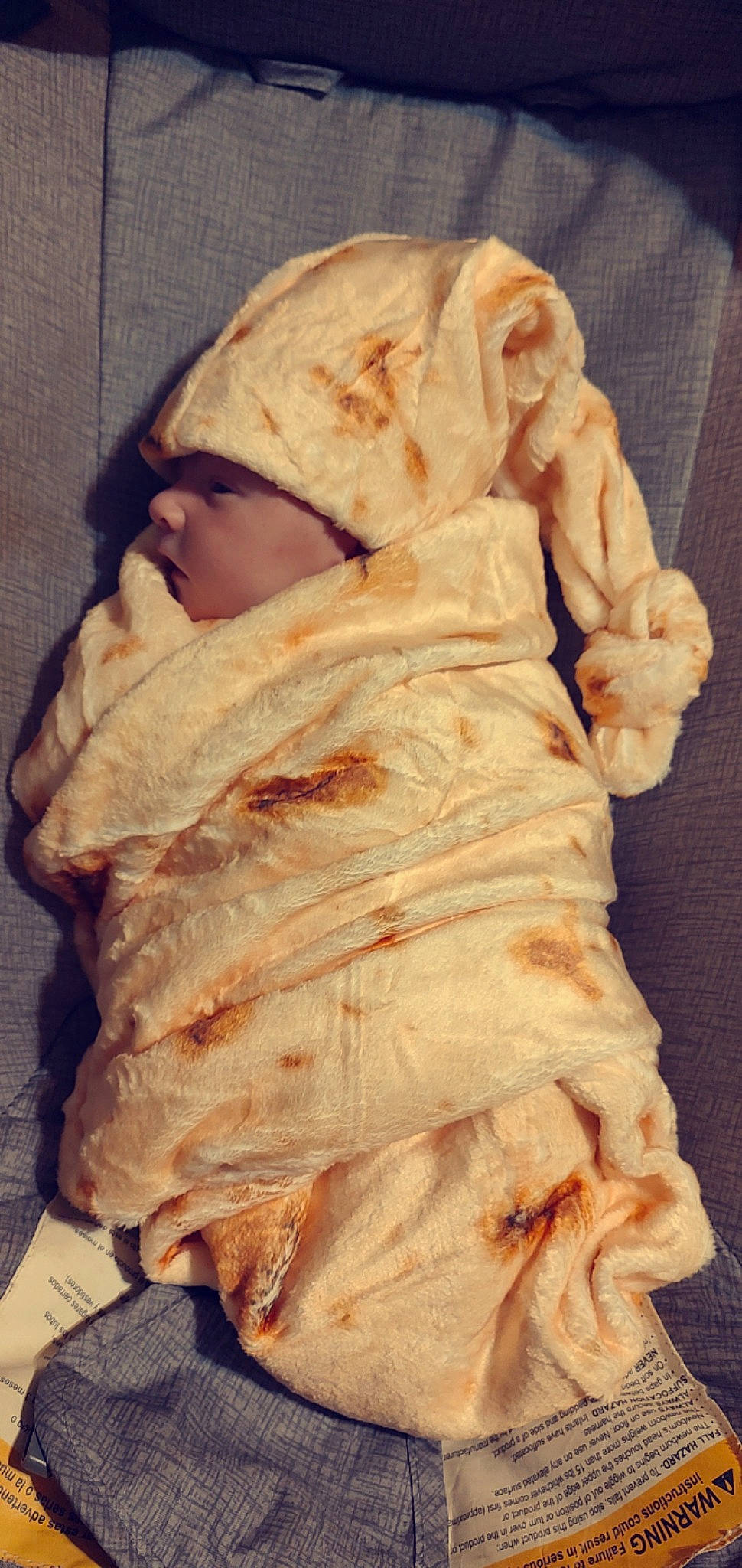 Francis is registered to the contest to win money with this photo: art, artifact, baby, baby_products, baby_toddler_clothing, cap, cheek, child, comfort, eye, fur, head, headwear, human_body, knit_cap, linens, outerwear, person, sitting, sleeve