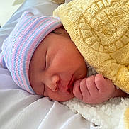 Braxxas joined the competition — help win amazing prizes! newborn, baby, sleeping, blanket, hat, hand, soft, cute, face, infant, cozy, resting, bed, closeup, skin, wrapped, peaceful, portrait, child, indoors