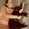 Shiva participe au concours pour gagner de l'argent avec cette photo : woman, dog, couch, sleeping, pet, collar, indoor, cozy, relaxed, cushion, furniture, casual_clothing, resting, black_dog, human, animal, comfort, nap, tattoo, arm