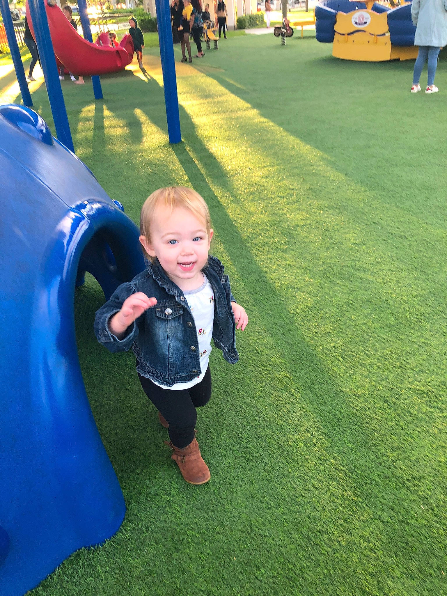 Adeline joined the competition — help win amazing prizes! child, city, fun, grass, green, human_settlement, lawn, leisure, outdoor_play_equipment, park, person, plant, play, playground, playground_slide, public_space, recreation, smile, toddler, vacation