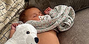 Ada-Violet is registered to the contest to win money with this photo: baby, sleeping, pacifier, teddy_bear, diaper, couch, pillow, blanket, plush_toy, infant, child, rest, comfort, soft_toy, relaxation, indoor, cute, cozy, person, home