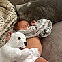 baby, blanket, child, comfort, couch, cozy, cute, diaper, home, indoor, infant, pacifier, person, pillow, plush_toy, relaxation, rest, sleeping, soft_toy, teddy_bear