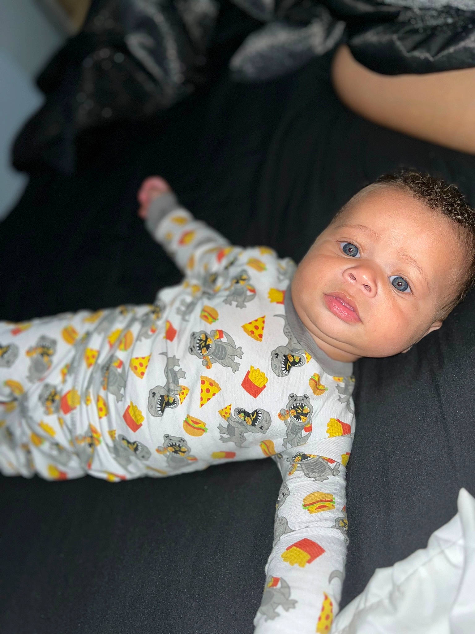 Elias is registered to the contest to win money with this photo: arm, baby, baby_toddler_clothing, carmine, child, comfort, finger, flash_photography, flooring, fun, hand, happy, human_body, leg, pattern, person, room, sitting, sleeve, textile