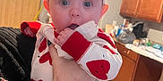 Scarlett is registered to the contest to win money with this photo: accessories, baby, bag, baseballcap, biting, bonnet, cap, clothing, coat, costume, eating, face, food, handbag, hat, head, jacket, person, photography, portrait