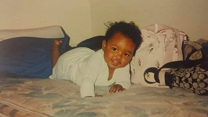 Adrienne is registered to the contest to win money with this photo: adaptation, baby, bedtime, black_hair, child, ear, eye, floor, flooring, forehead, fun, hair, hairstyle, head, joy, person, smile, toddler