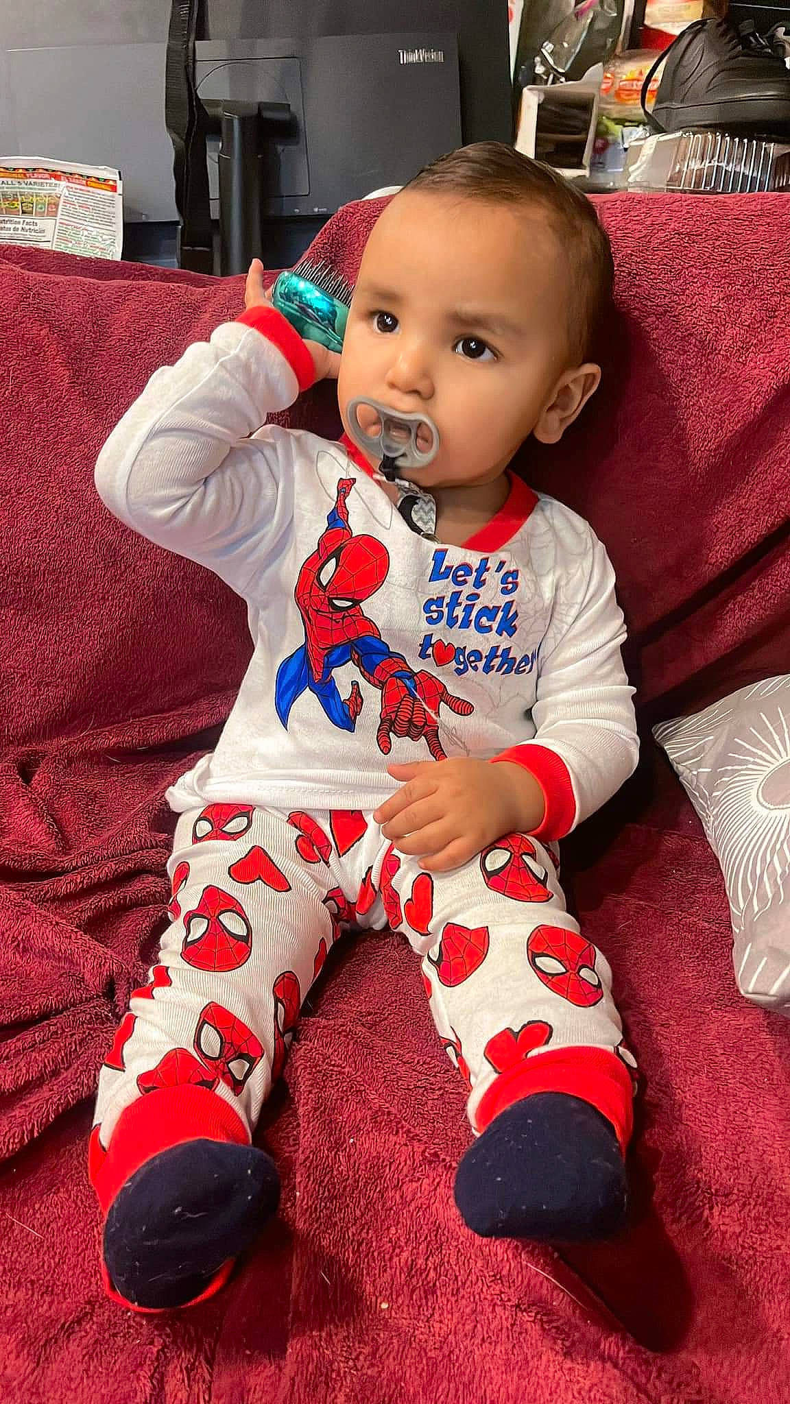 Jeremiah joined the competition — help win amazing prizes! baby, baby_toddler_clothing, carmine, cheek, child, christmas_eve, comfort, couch, face, flooring, happy, head, holiday, pattern, person, play, red, sitting, sleeve, sock