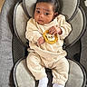 baby, infant, child, face, clothing, socks, seat, cushion, fabric, cute, indoors, portrait, young, expression, looking, human, hands, feet, lion_patch, cozy