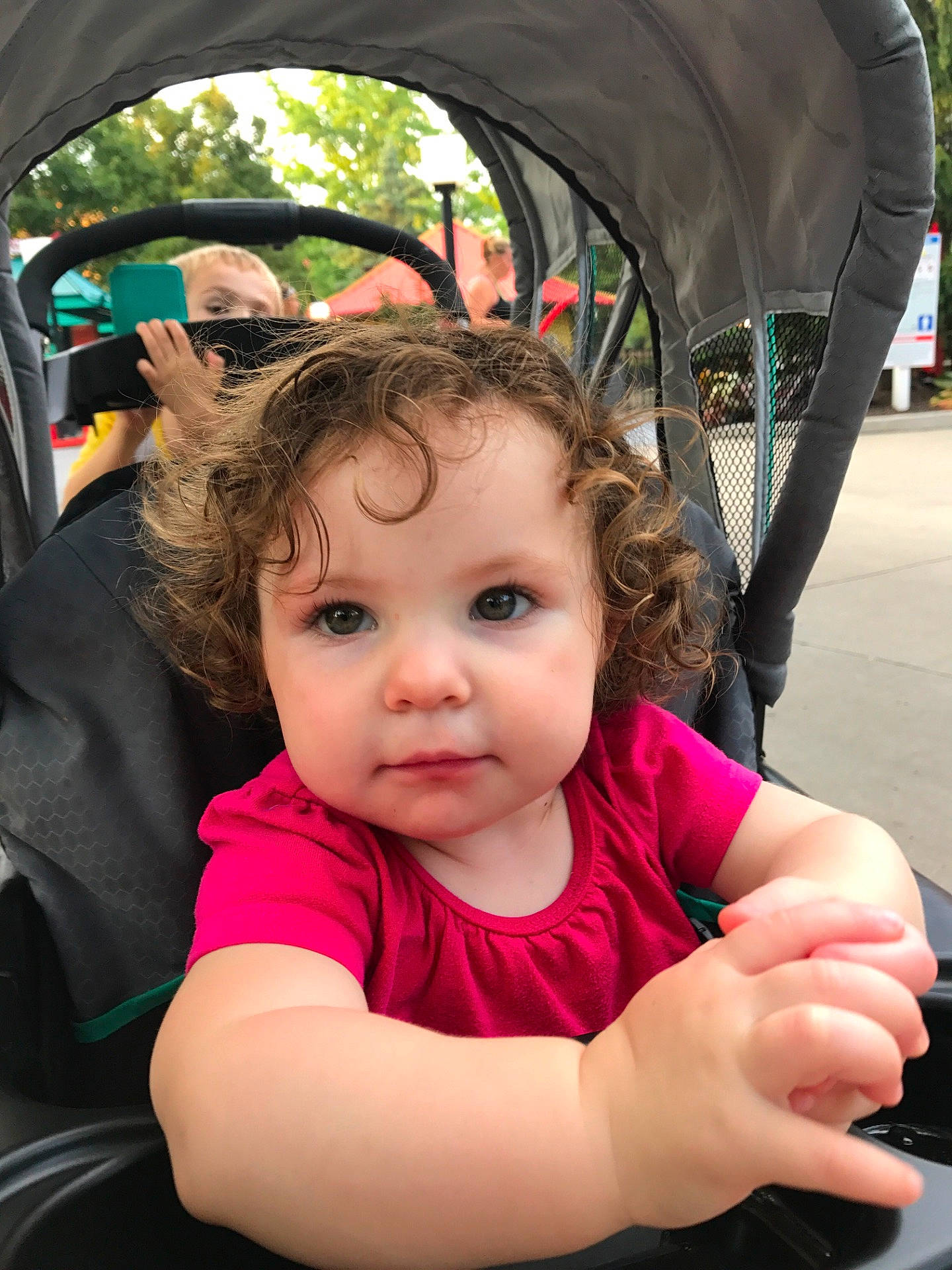 Sofia is registered to the contest to win money with this photo: car, car_seat, child, cool, ear, eye, face, fun, girl, hair, hairstyle, happiness, head, infant, person, product, sitting, skin, smile, toddler