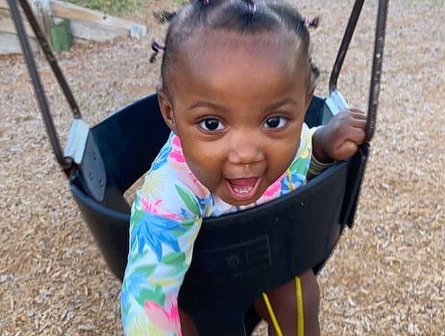 Erial joined the competition — help win amazing prizes! baby, cheek, city, eye, fun, grass, happy, head, leisure, outdoor_play_equipment, person, plant, playground, product, recreation, sitting, skin, smile, swing, toddler