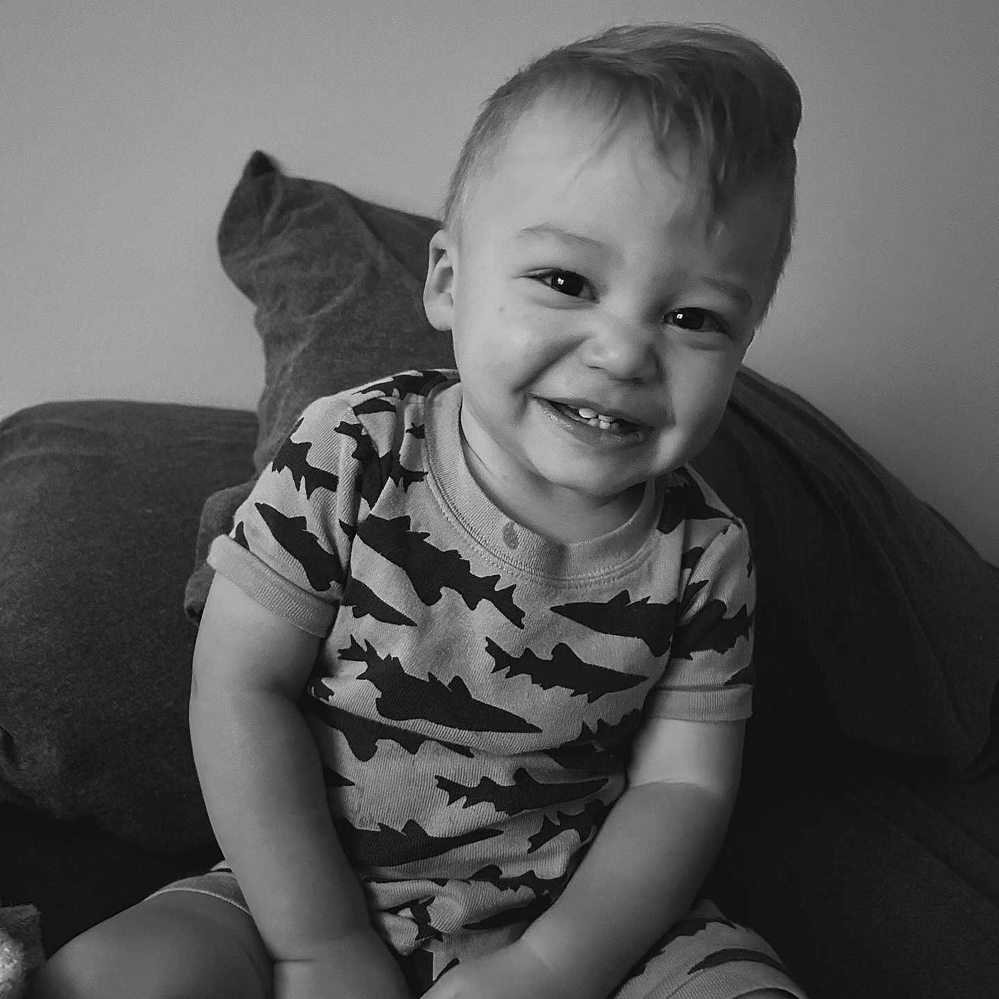 Caedyn is registered to the contest to win money with this photo: baby, babylaughing, bodypart, clothing, couch, cushion, face, finger, furniture, hand, happy, head, homedecor, laughing, person, photography, portrait, sitting, smile, t_shirt