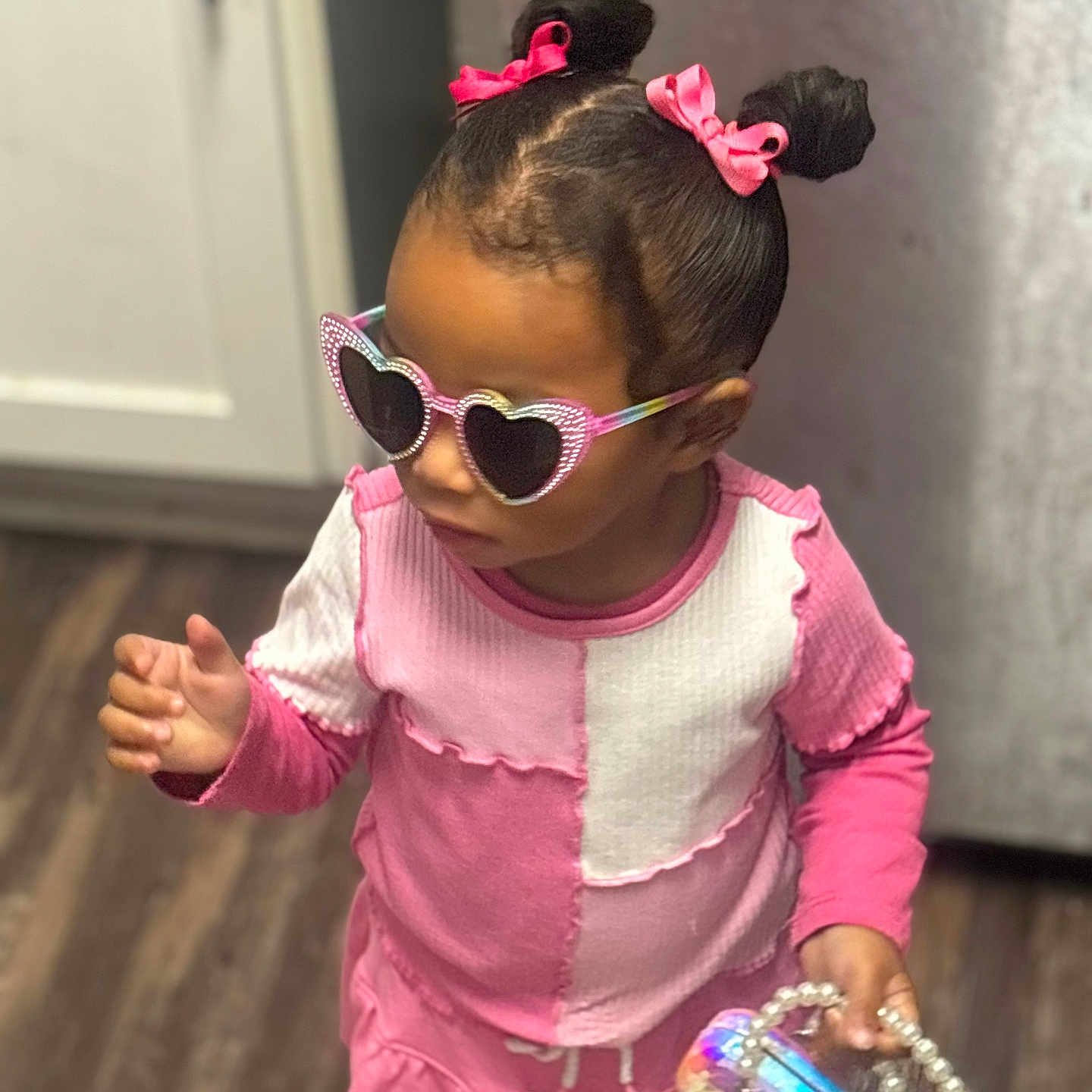 Corina is registered to the contest to win money with this photo: accessories, blackhair, bodypart, bunhairstyle, child, clothing, dancing, face, female, finger, girl, hair, hand, head, leisureactivities, person, photography, portrait, sleeve, sunglasses