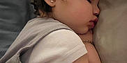 Anastasia is registered to the contest to win money with this photo: child, toddler, sleeping, face, earring, bracelet, pillow, cozy, clothing, arm, hair, peaceful, portrait, indoor, closeup, skin, baby, rest, relaxation, cute