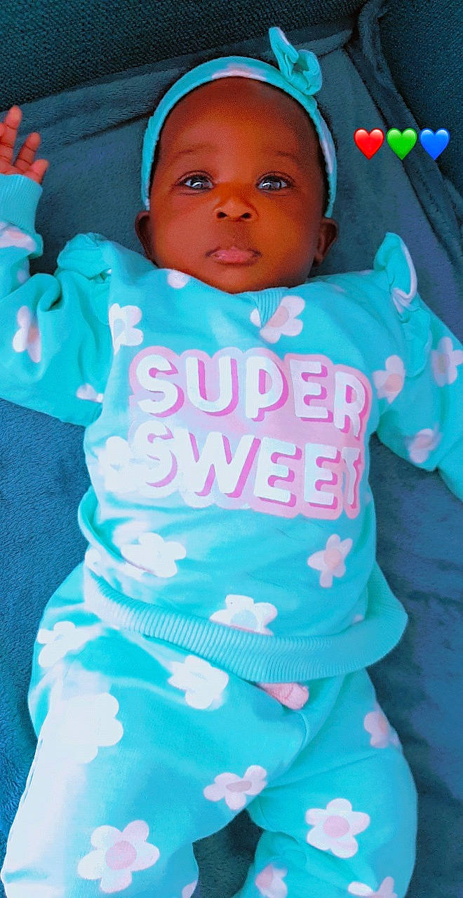 Aminah participe au concours pour gagner de l'argent avec cette photo : azure, baby, baby_toddler_clothing, blue, cheek, eye, eyebrow, facial_expression, green, happy, head, mouth, nose, organ, person, pink, product, skin, sleeve, textile