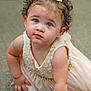 toddler, child, baby, curly_hair, bow, dress, crawling, carpet, indoors, portrait, cute, face, eyes, pearl, white_dress, baby_girl, expression, skin, hand, floor