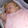 baby, sleeping, pink_dress, embroidery, blanket, stroller, infant, peaceful, face, head, closeup, soft_texture, knitted, cozy, cute, child, resting, portrait, delicate, fabric
