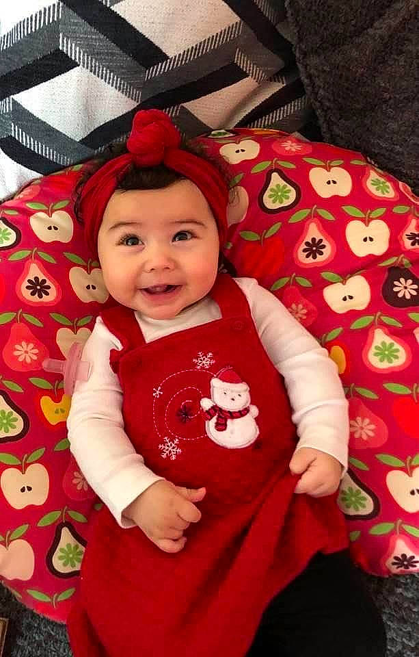 Giana is registered to the contest to win money with this photo: baby, baby_laughing, baby_products, baby_toddler_clothing, cheek, child, costume_accessory, eye, headwear, human_body, joy, person, sleeve, toddler, tongue