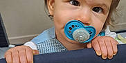 Valentyna a rejoint le concours — aidez-le/la à gagner de superbes lots ! toddler, child, pacifier, playpen, hands, face, eyes, curious, indoor, baby, clothing, blue, grip, portrait, young, person, cute, expression, infant, hair