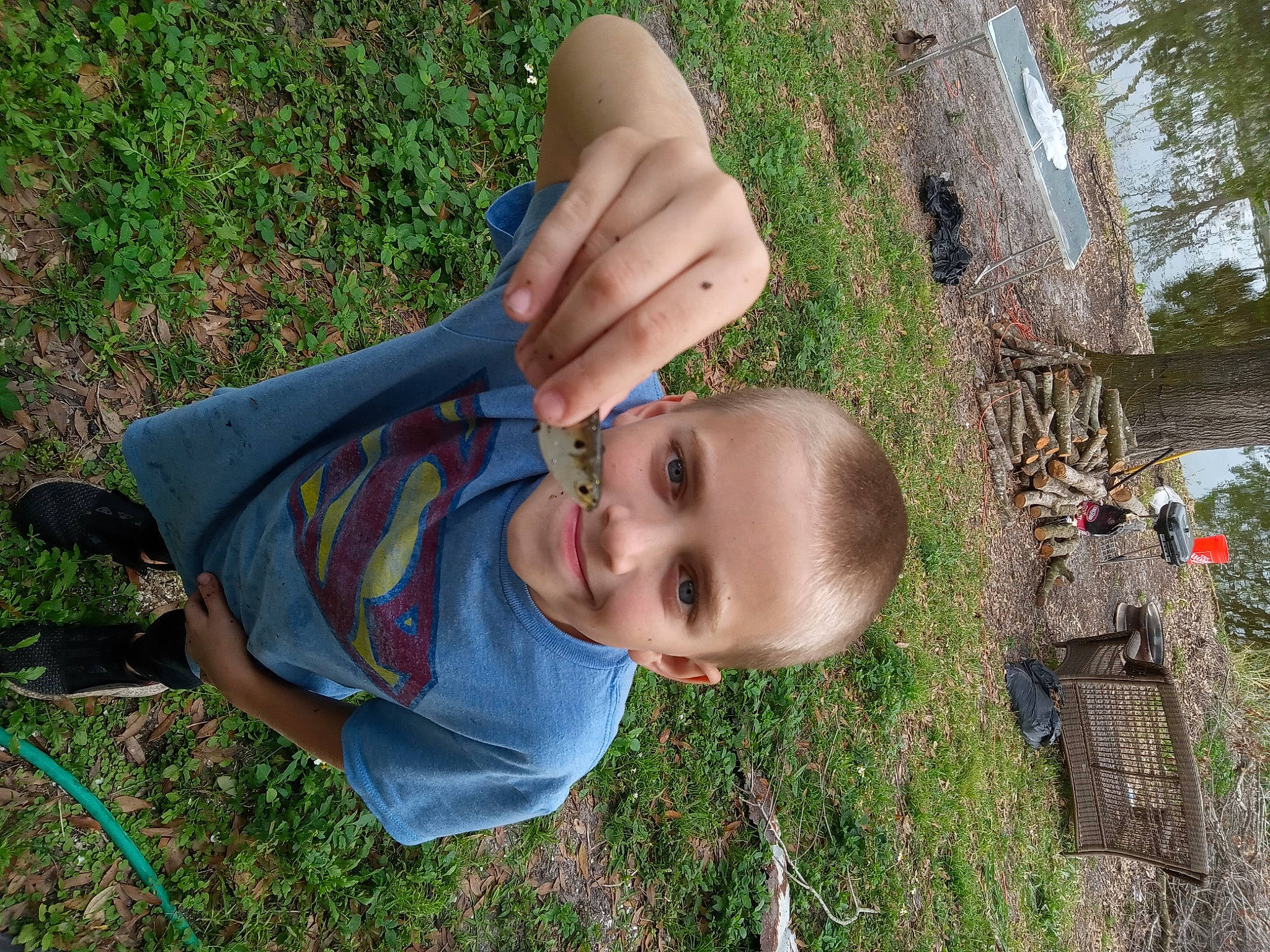 Chase is registered to the contest to win money with this photo: baby, baby_toddler_clothing, child, cool, fun, gesture, grass, grass_family, grassland, happy, human_body, joy, leaf, leisure, people_in_nature, person, plant, smile, toddler, tree