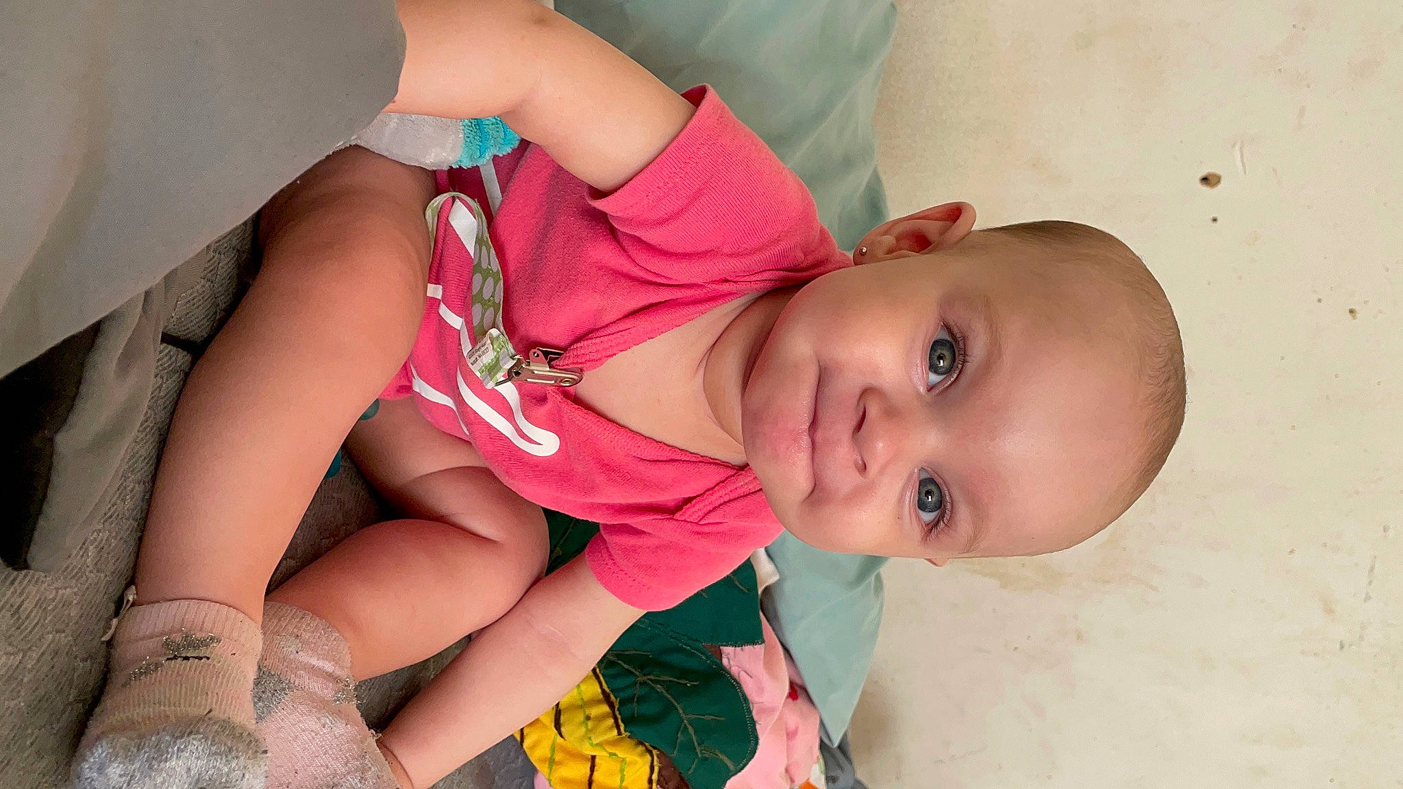 Amayah is registered to the contest to win money with this photo: arm, baby, baby_toddler_clothing, chest, dress, eye, eyelash, finger, glasses, hair, human_body, joint, leg, lip, mouth, neck, person, pink, skin, stomach