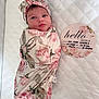 Ava joined the competition — help win amazing prizes! announcement_card, baby, blanket, child, cute, decor, face, floral_pattern, headband, infant, lying_down, newborn, person, pink, portrait, quilt, sleepy, soft_lighting, swaddle, white_background
