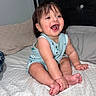 Aarón joined the competition — help win amazing prizes! baby, child, smiling, sitting, bed, pillow, headboard, infant, happy, indoors, clothing, feet, hand, face, hair, pattern, fabric, room, skin, person