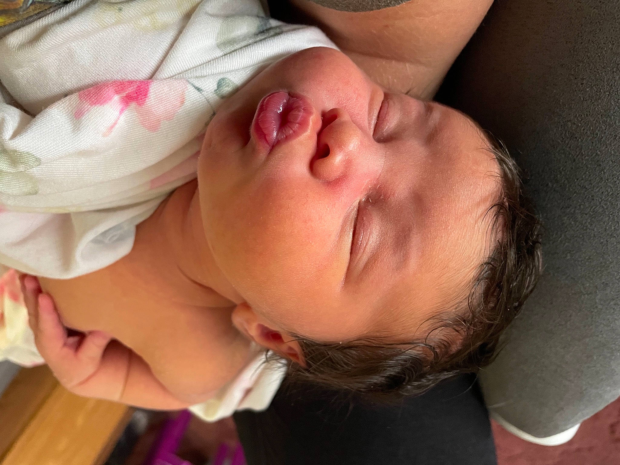 Jersey is registered to the contest to win money with this photo: arm, baby, cheek, chin, ear, eye, eyebrow, eyelash, face, forehead, glasses, hair, hand, head, human_body, lip, mouth, neck, nose, person