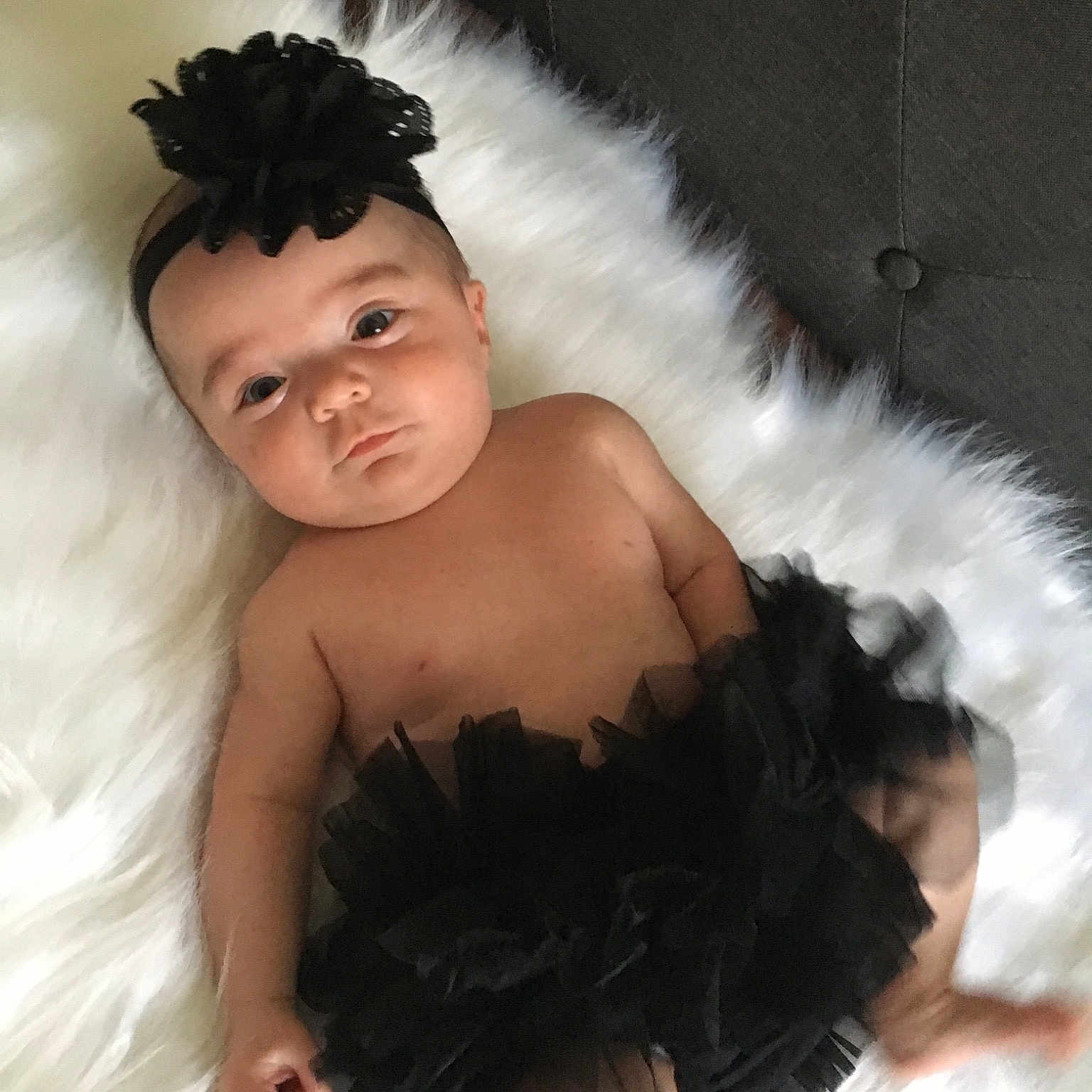 Julia joined the competition — help win amazing prizes! baby, black_and_white, black_hair, child, child_model, costume, costume_accessory, dress, fashion_accessory, feather_boa, fur, hair_accessory, headpiece, person, photo_shoot, photography, skin, toddler, white