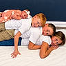Eleanor joined the competition — help win amazing prizes! children, siblings, baby, toddler, family, group_portrait, smiling, happy, lying_down, playful, stacked, indoor, floor, rug, blue_wall, white_shirts, pink_outfit, bow_headband, red_hair, family_photography
