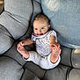 baby, infant, smiling, couch, cushion, upholstery, onesie, legs, feet, toes, sitting, cozy, happy, portrait, pillow, fabric, sunlight, indoor, hand, playful