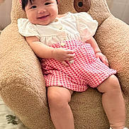 Havia joined the competition — help win amazing prizes! baby, child, smiling, infant, pink_clothing, headband, white_shoes, teddy_bear_chair, plush, cute, happy, indoors, soft_texture, seated, legs, hand, face, footwear, comfort, portrait