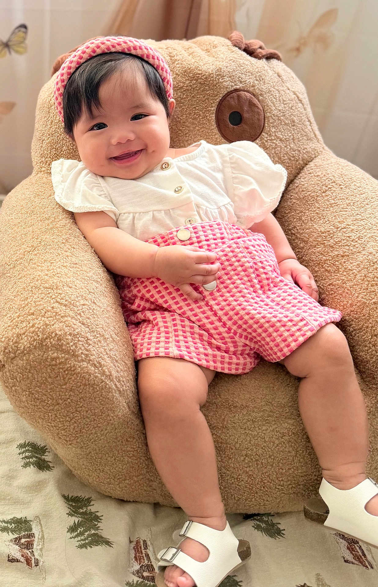 Havia joined the competition — help win amazing prizes! baby, child, smiling, infant, pink_clothing, headband, white_shoes, teddy_bear_chair, plush, cute, happy, indoors, soft_texture, seated, legs, hand, face, footwear, comfort, portrait