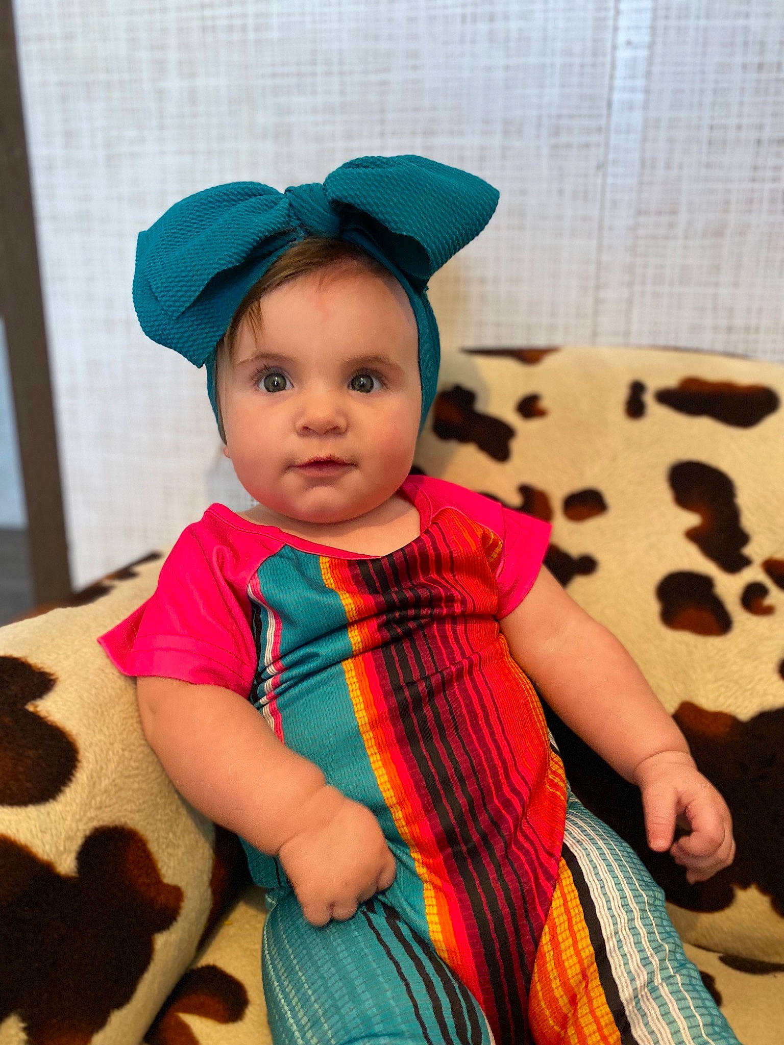 Kodie joined the competition — help win amazing prizes! baby, baby_toddler_clothing, cap, child, electric_blue, fashion_accessory, happy, headgear, magenta, pattern, person, pink, plaid, sitting, skin, sleeve, t_shirt, tartan, textile, toddler