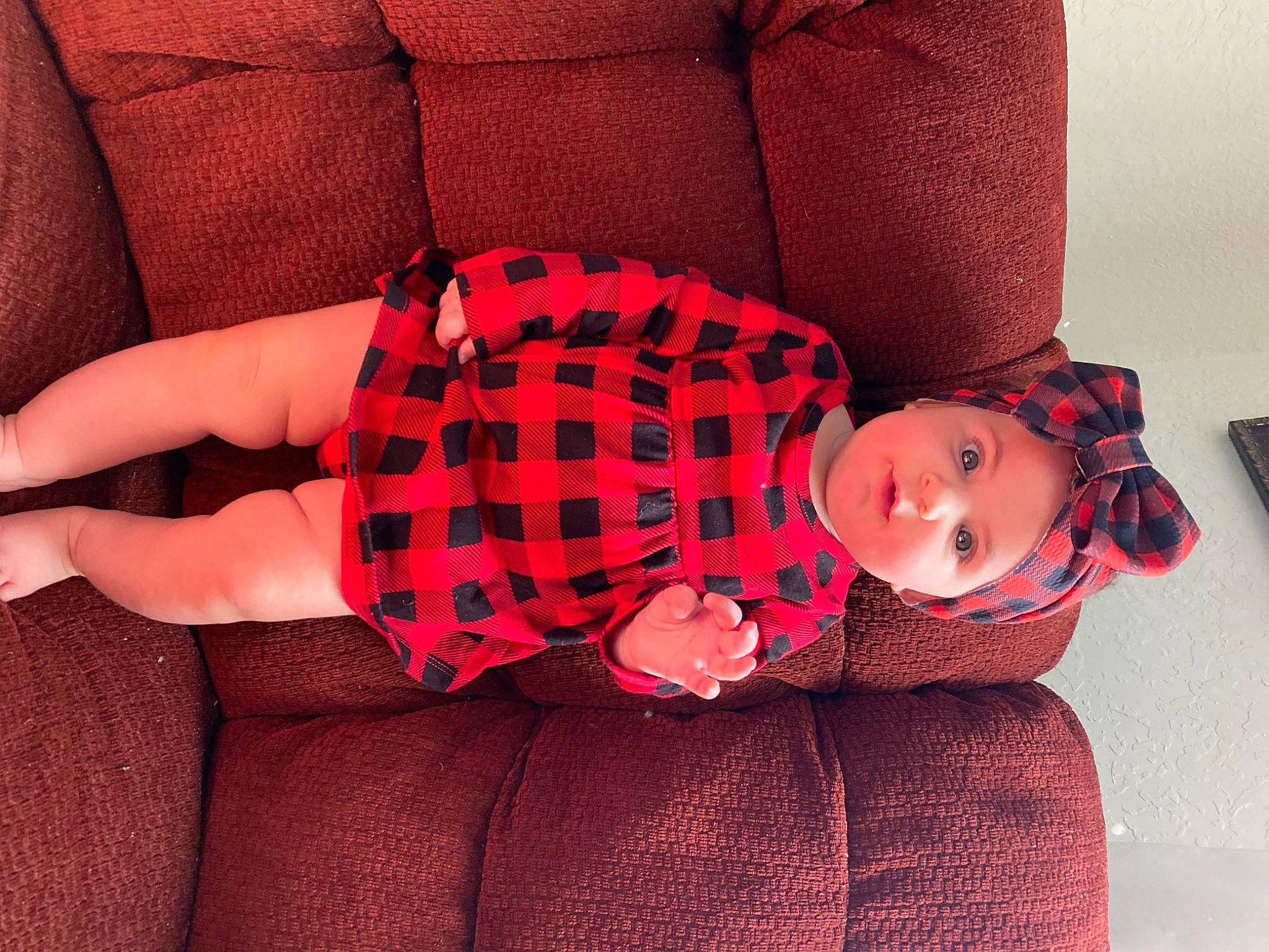Kodie joined the competition — help win amazing prizes! baby, baby_toddler_clothing, comfort, dress, finger, glasses, hand, headgear, headwear, human_body, joint, knee, leg, outerwear, person, pink, plant, red, sleeve, tartan