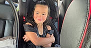 Cattaleya is registered to the contest to win money with this photo: architecture, building, car, car_interior, carseat, child, cushion, face, female, girl, head, headrest, homedecor, outdoors, person, photography, portrait, teen, transportation, vehicle